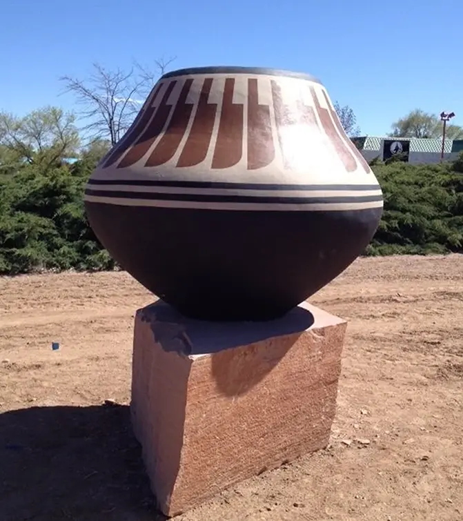 San Ildefonso pottery replica installed on a custom sandstone base in White Rock, NM, as part of a public art installation honoring Pueblo pottery traditions.